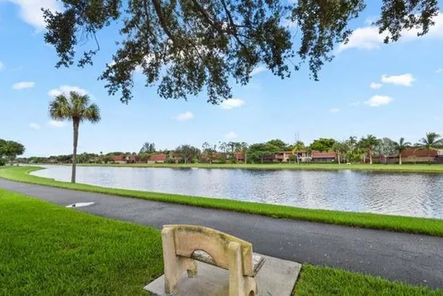a view of a lake with houses in the back