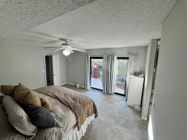 a bed room with a bed and a mirror