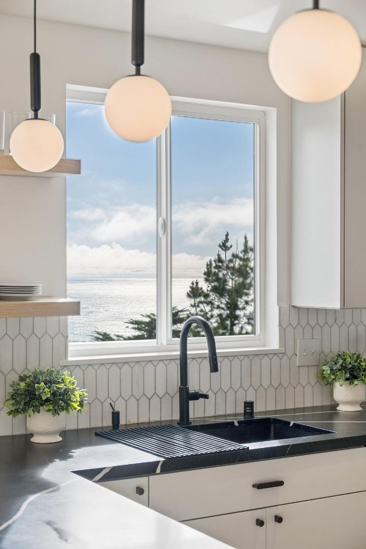 170 Beachview Avenue Pacifica, CA 94044 - Photo 12 of 85 a bathroom with a granite countertop sink and a mirror