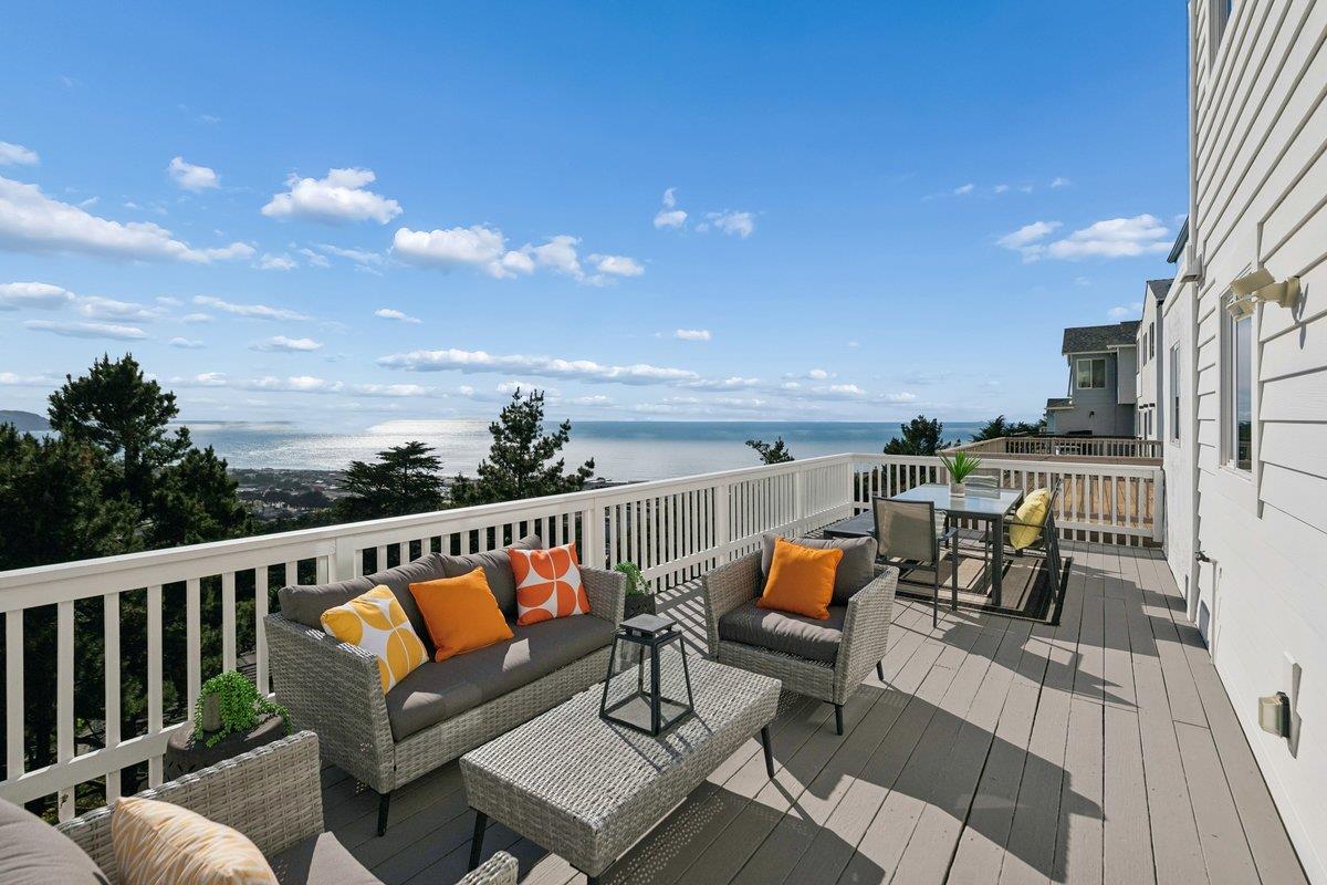 170 Beachview Avenue Pacifica, CA 94044 - Photo 2 of 85 a balcony with wooden benches and ocean view