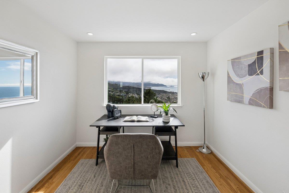 170 Beachview Avenue Pacifica, CA 94044 - Photo 54 of 85 a view of a workspace with wooden floor and a window
