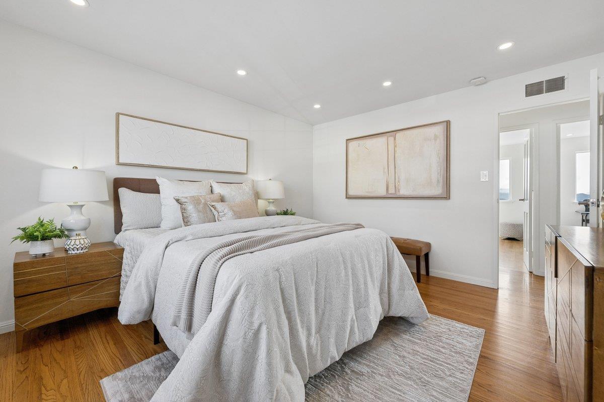 170 Beachview Avenue Pacifica, CA 94044 - Photo 59 of 85 a bedroom with bed and wooden floor