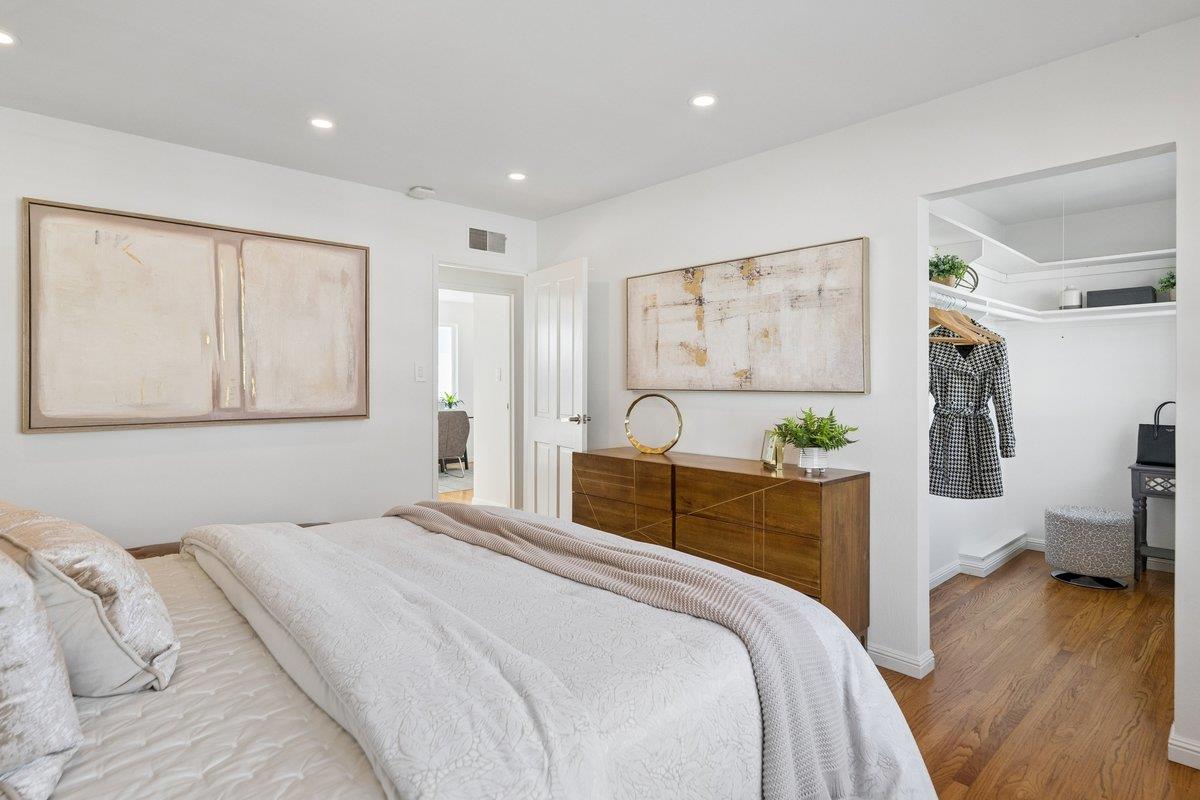 170 Beachview Avenue Pacifica, CA 94044 - Photo 60 of 85 a bedroom with a bed and wooden floor