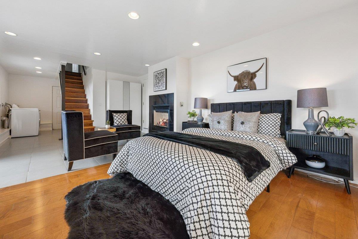 170 Beachview Avenue Pacifica, CA 94044 - Photo 66 of 85 a bedroom with a bed and wooden floor