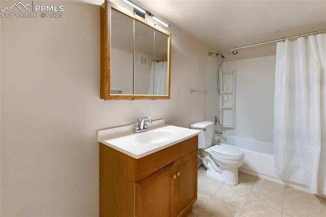 a bathroom with a sink toilet vanity and shower