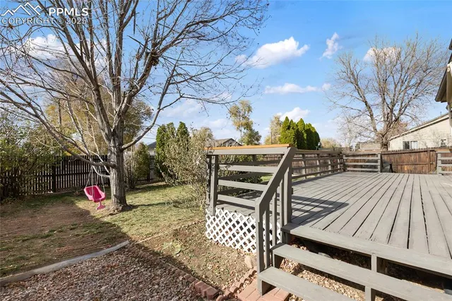 a view of a balcony with wooden floor