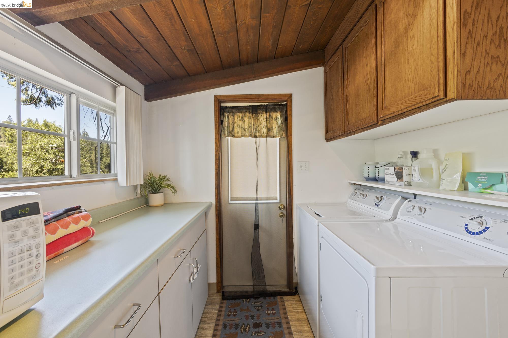 21815 Confidence Road Twain Harte, CA 95383 - Photo 16 of 30 a kitchen with a sink a refrigerator and window