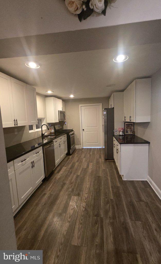 516 10th Avenue Lindenwold, NJ 08021 - Photo 2 of 7 a large kitchen with stainless steel appliances granite countertop a sink a stove and a refrigerator