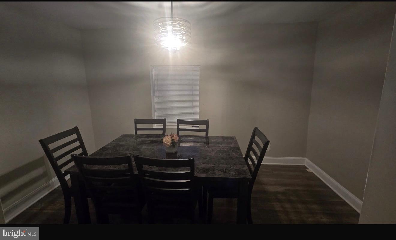 516 10th Avenue Lindenwold, NJ 08021 - Photo 4 of 7 a view of a dining room with furniture and wooden floor