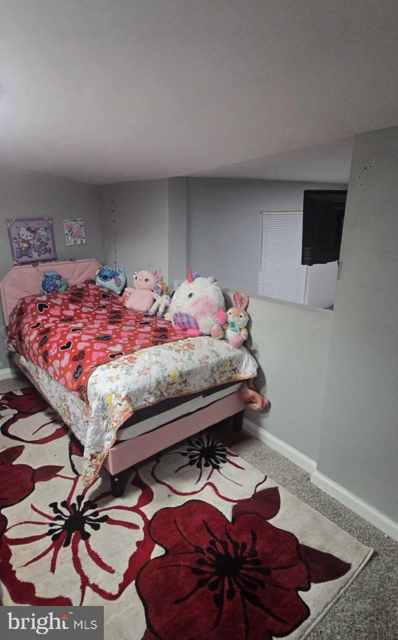 516 10th Avenue Lindenwold, NJ 08021 - Photo 7 of 7 a bedroom with a bed and a flat screen tv