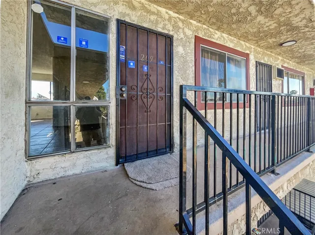 a kitchen with stainless steel appliances a sink and a refrigerator