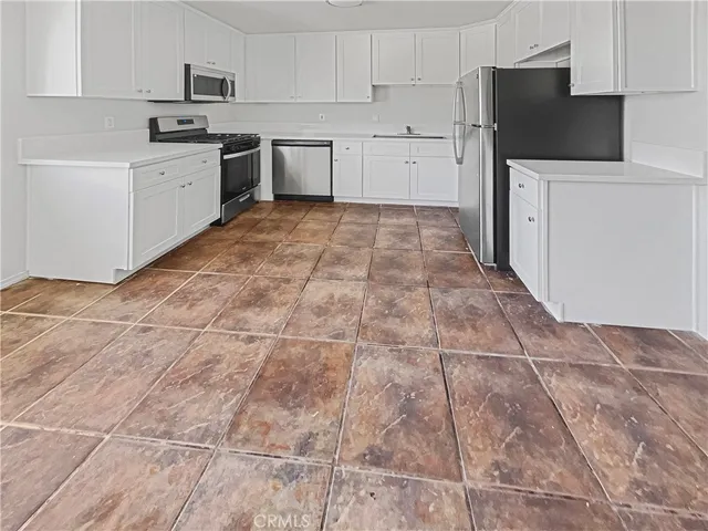 a bathroom with a sink a mirror and a shower