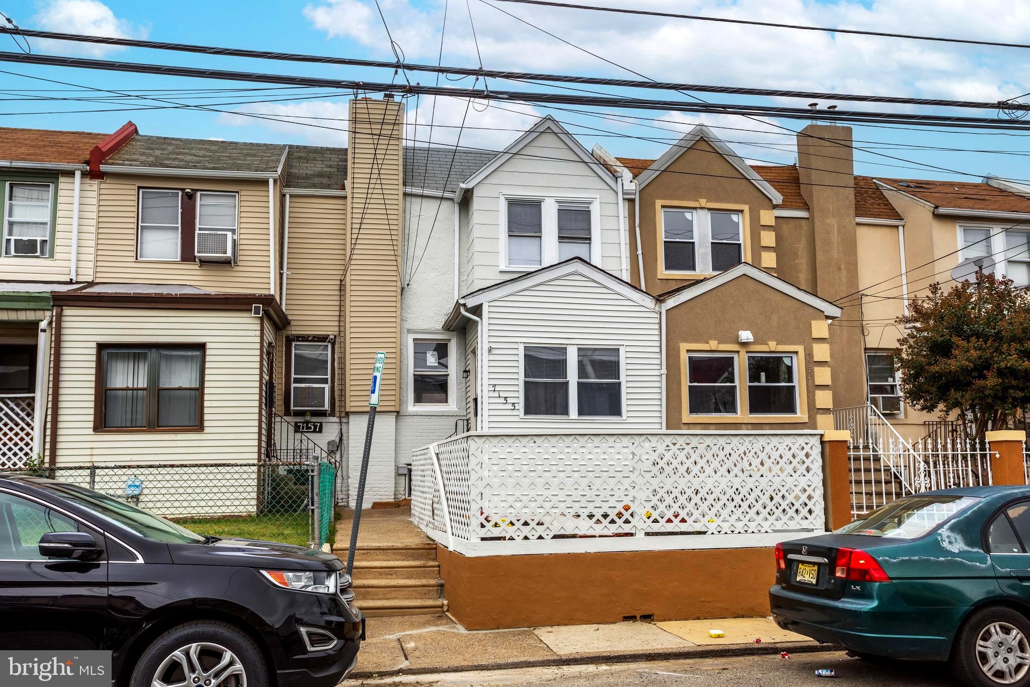 a front view of a house with parking space