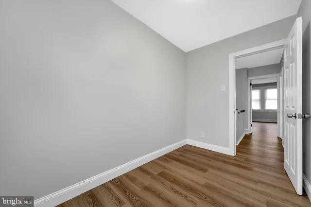 a view of a room with wooden floor and wooden floor