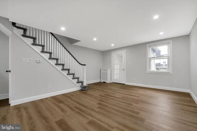 a view of an entryway with wooden floor