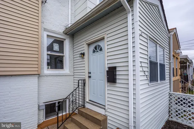 a view of a house with wooden deck
