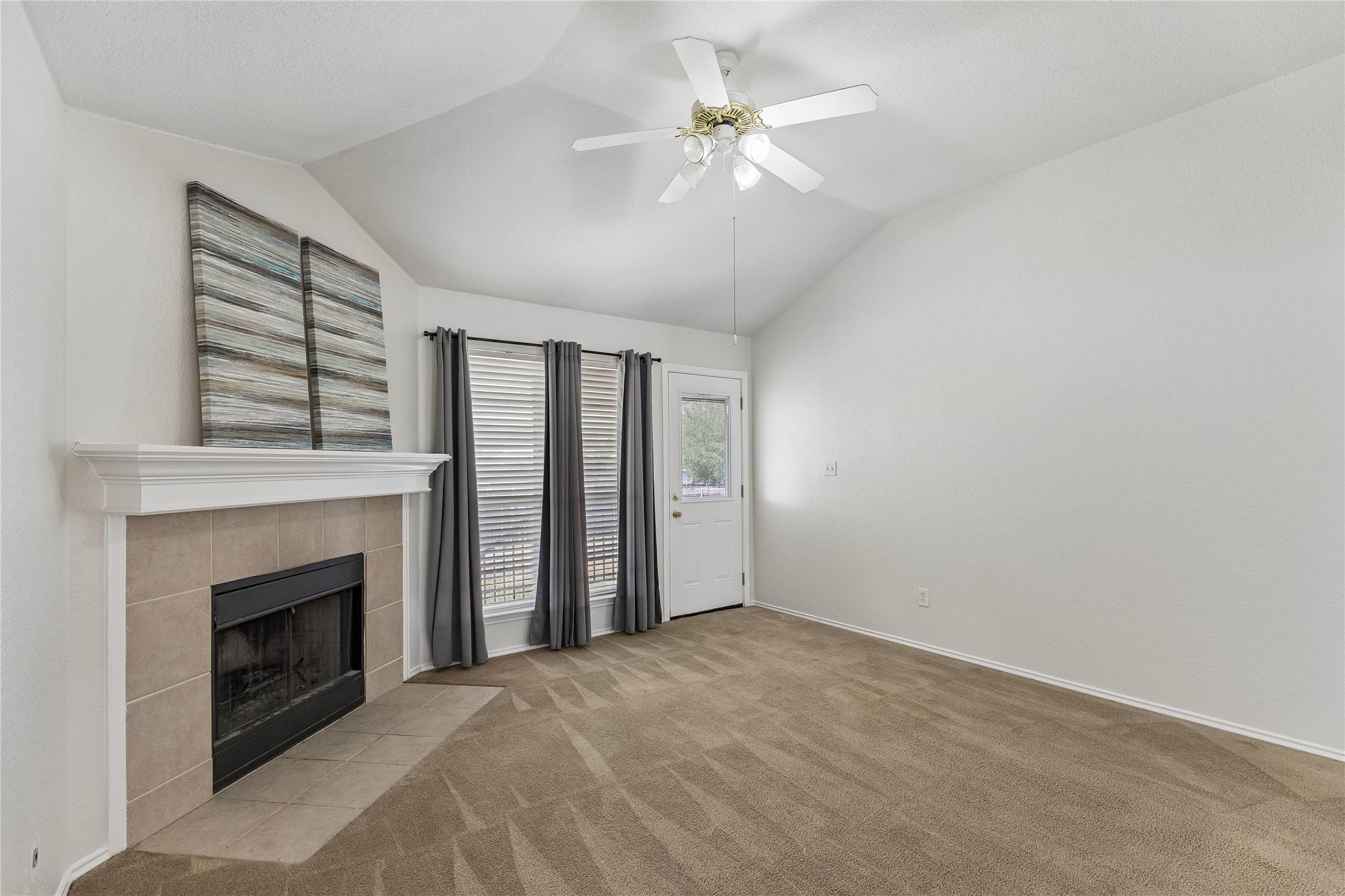 104 Cavalry Trail Elgin, TX 78621 - Photo 6 of 26 High ceilings in the living room for a spacious feel.
