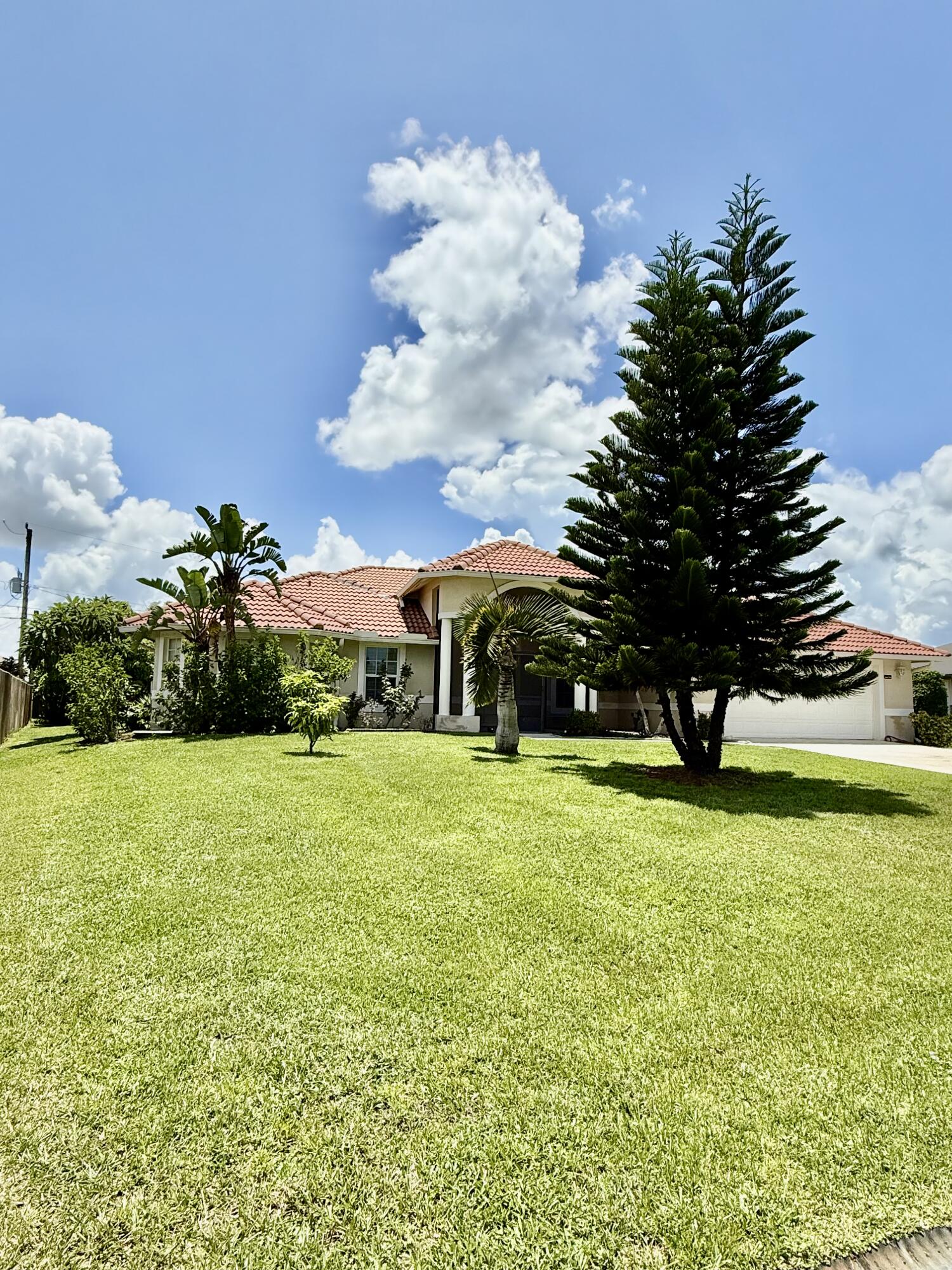 2810 Southeast Tate Avenue Port St. Lucie, FL 34984 - Photo 1 of 43 a view of a garden