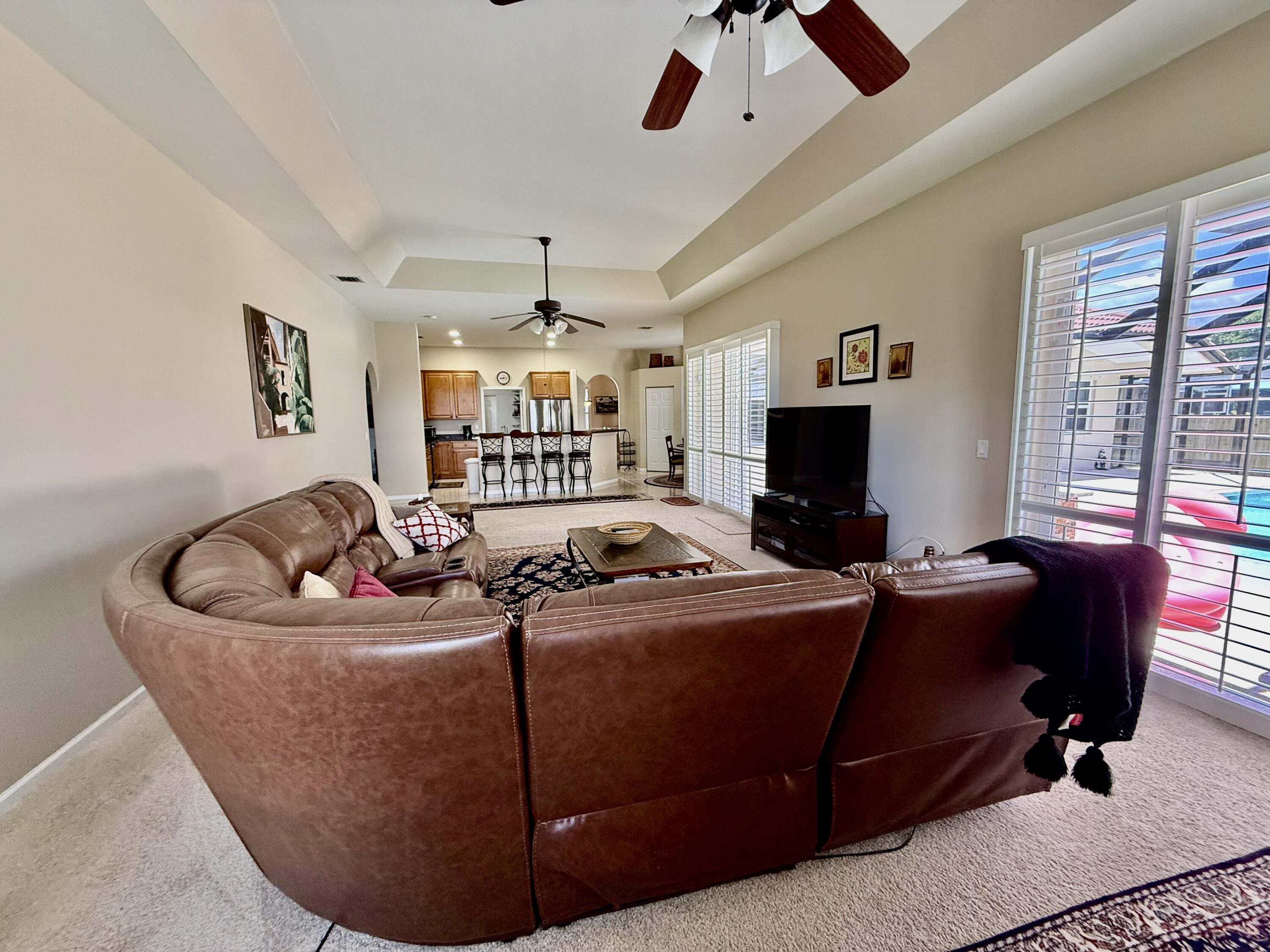 2810 Southeast Tate Avenue Port St. Lucie, FL 34984 - Photo 20 of 43 a living room with furniture and a flat screen tv