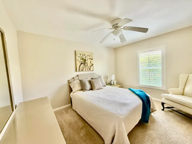a bedroom with a bed furniture and a window