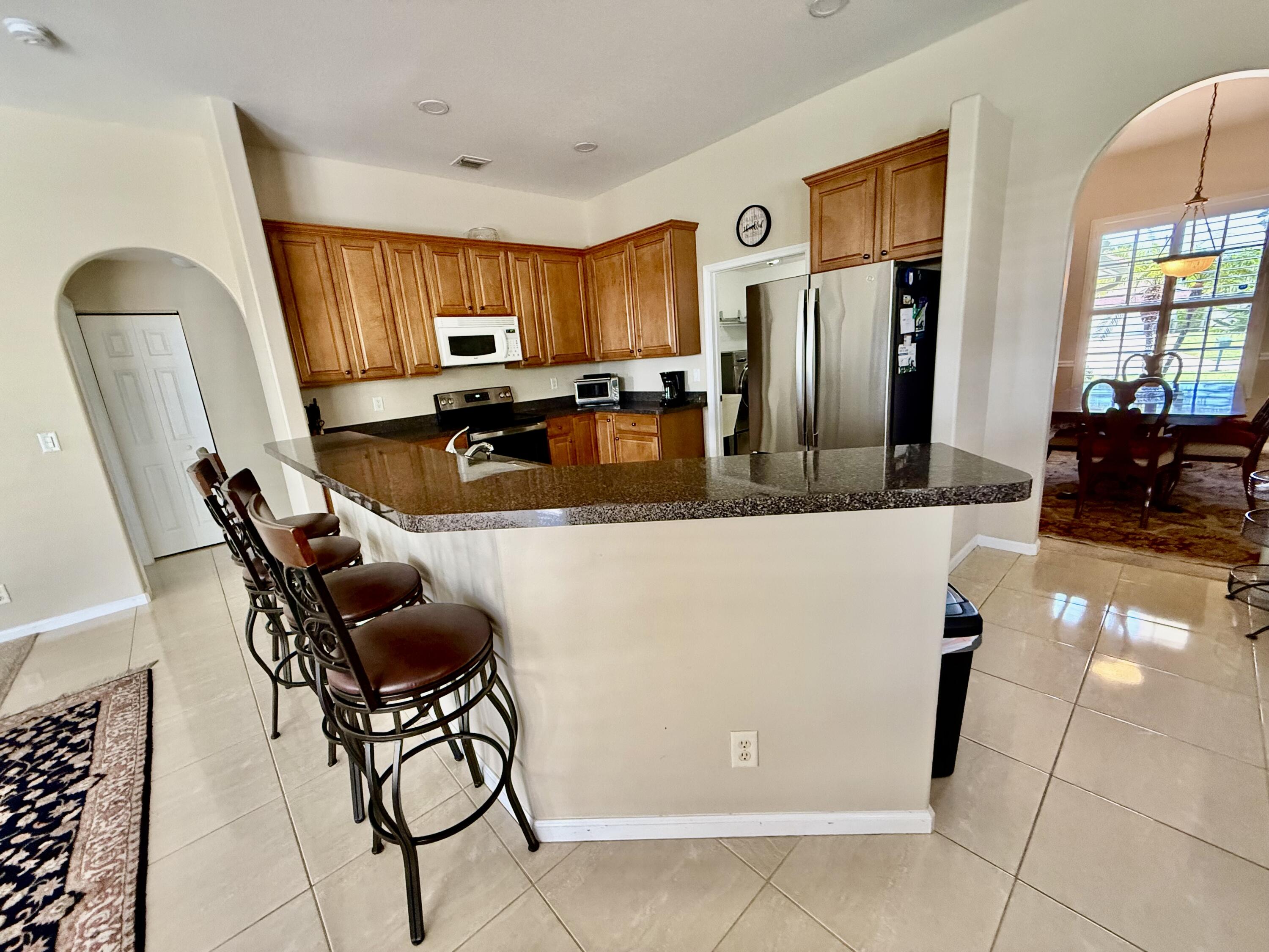 2810 Southeast Tate Avenue Port St. Lucie, FL 34984 - Photo 33 of 43 a view of a dining room with furniture