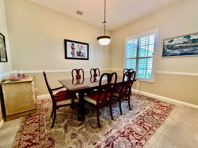 a view of a dining room with furniture