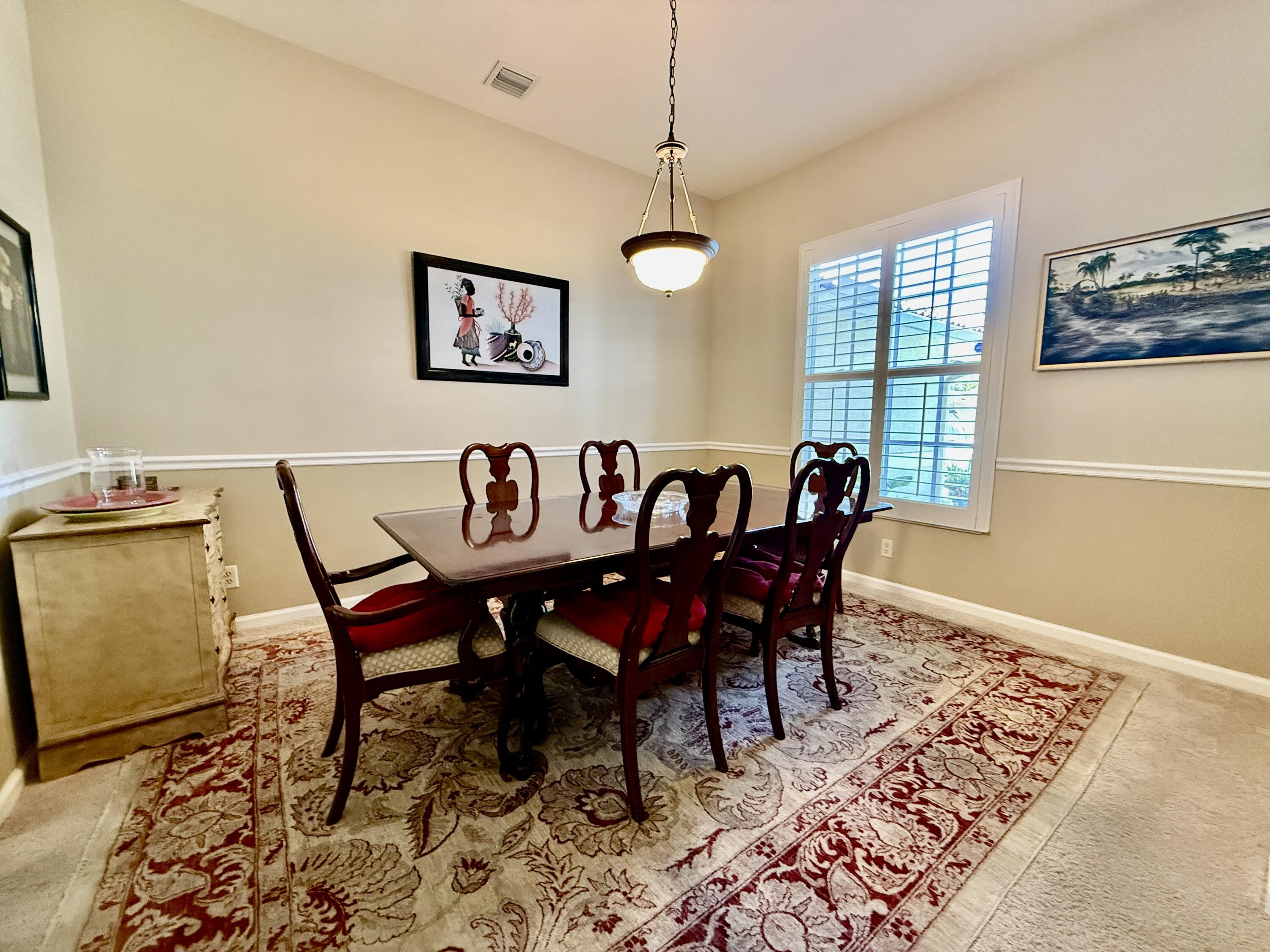2810 Southeast Tate Avenue Port St. Lucie, FL 34984 - Photo 43 of 43 a view of a dining room with furniture