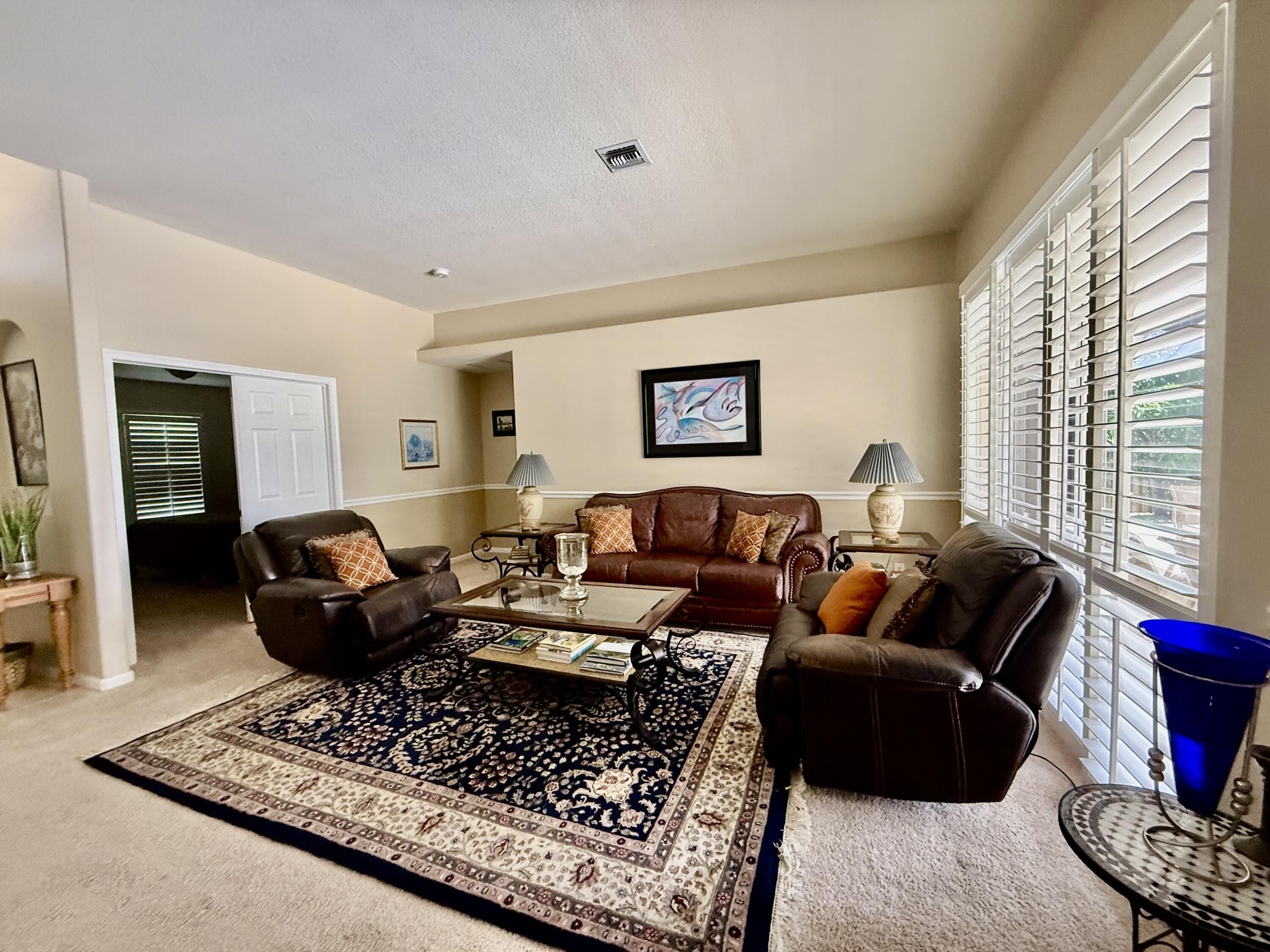 2810 Southeast Tate Avenue Port St. Lucie, FL 34984 - Photo 6 of 43 a living room with furniture a rug and a window