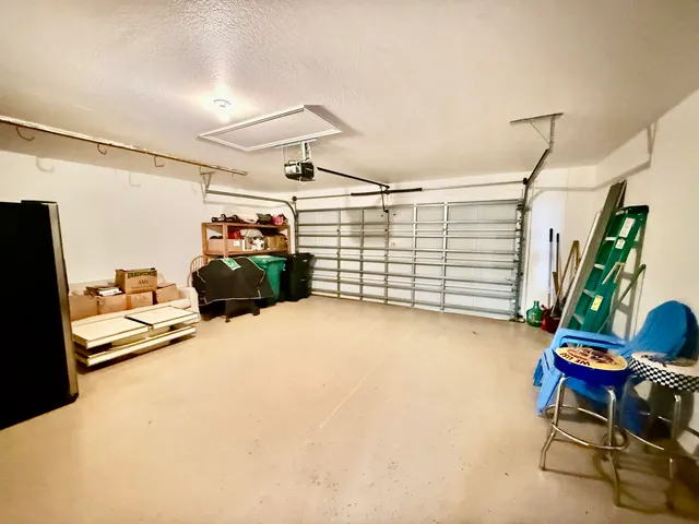 a view of a garage with furniture and a window