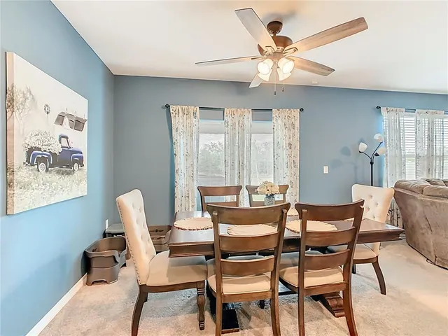 a dining room with furniture and window