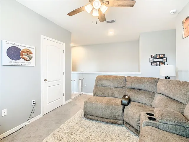 a living room with furniture and a rug