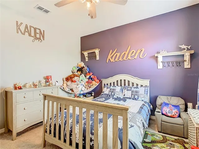 a bedroom with furniture and a window