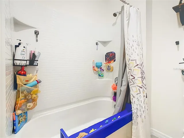 a bathroom with a bath tub