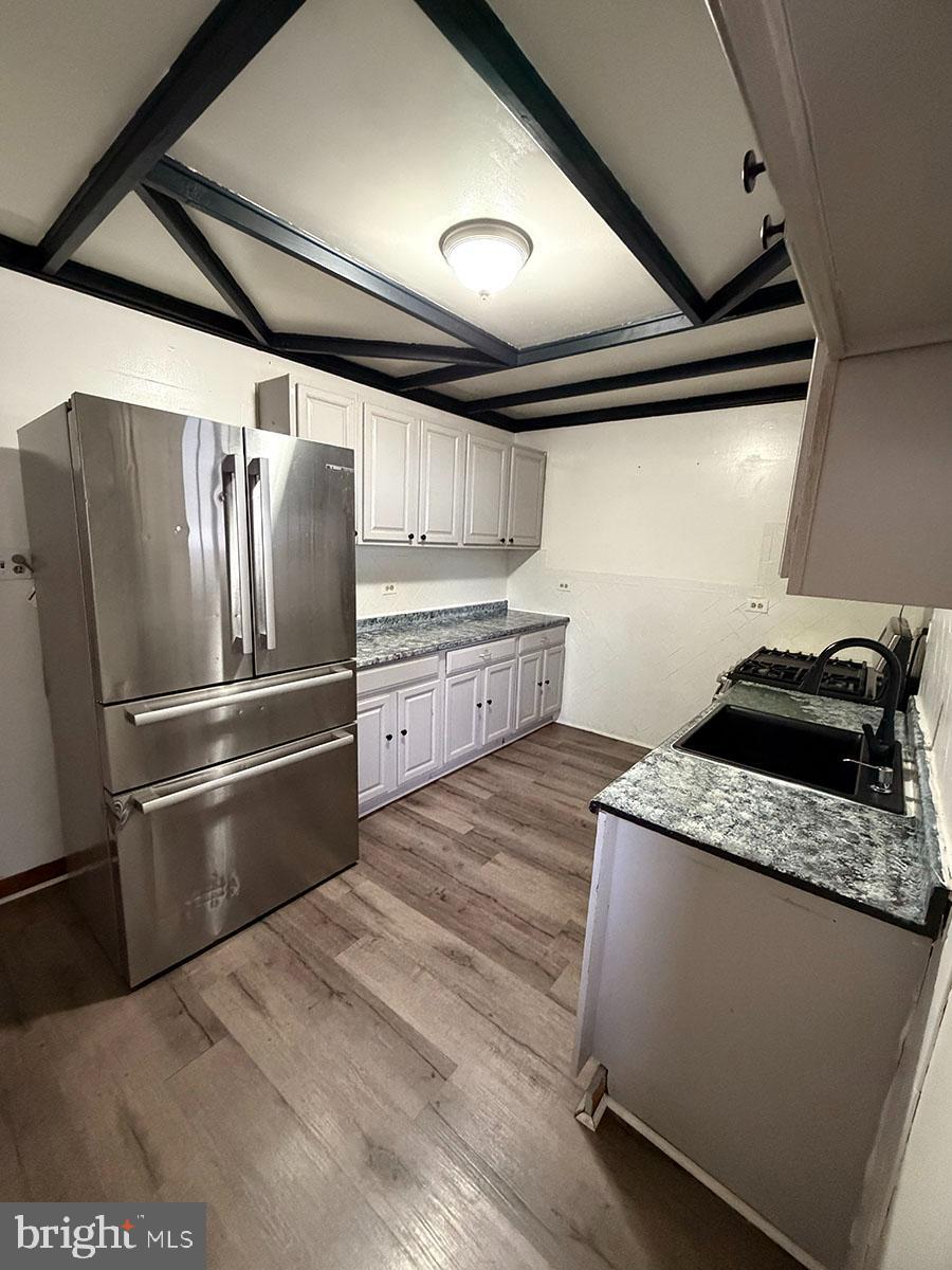 2736 A Street Philadelphia, PA 19134 - Photo 5 of 24 a kitchen with granite countertop a refrigerator and a stove top oven