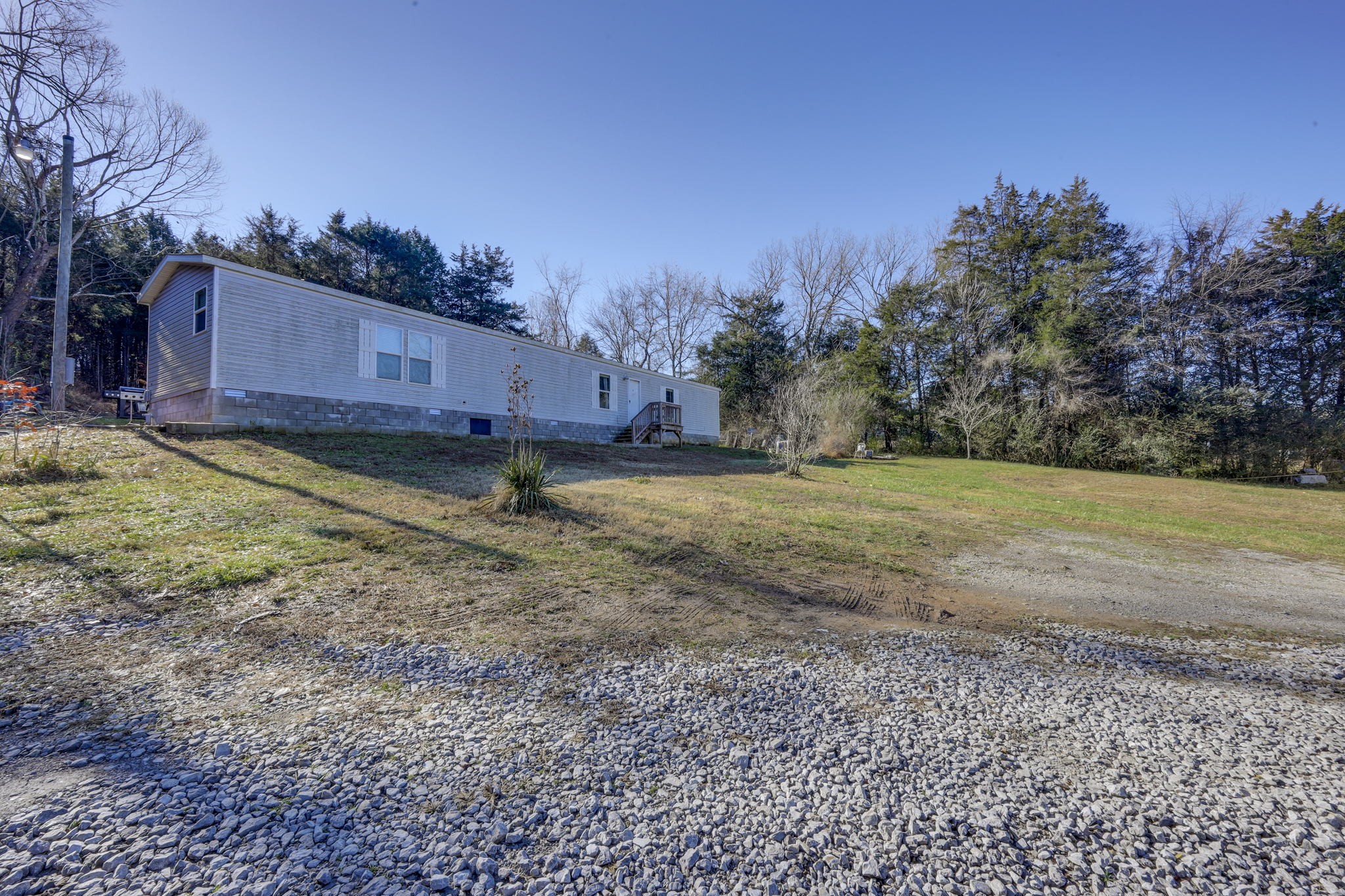 474 Hiwassee Road Lebanon, TN 37087 - Photo 1 of 25 a view of a backyard with large trees
