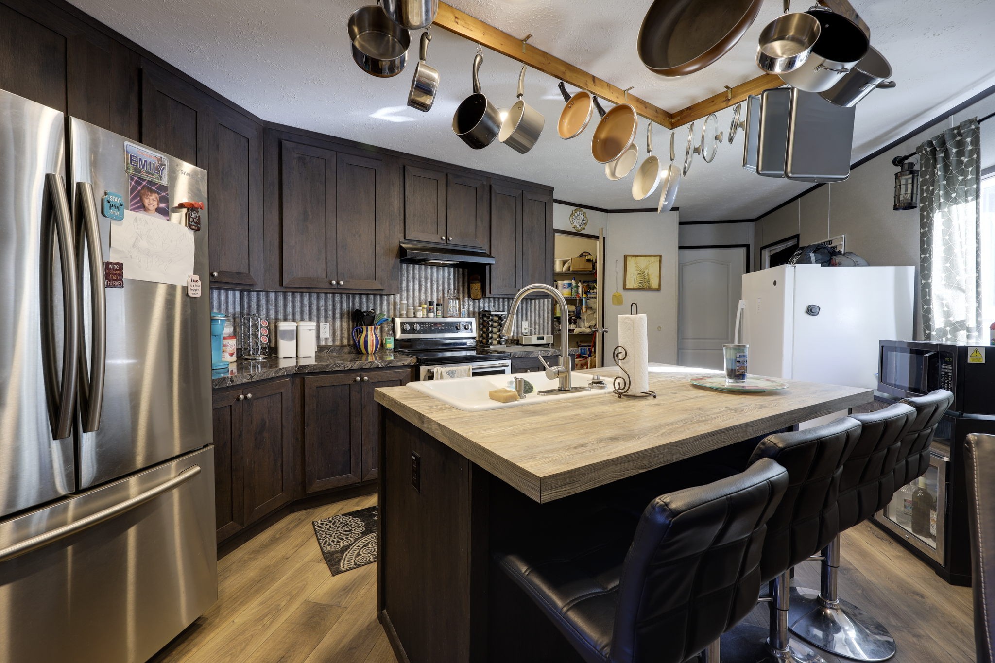 474 Hiwassee Road Lebanon, TN 37087 - Photo 8 of 25 a kitchen with stainless steel appliances granite countertop a sink a stove and a refrigerator