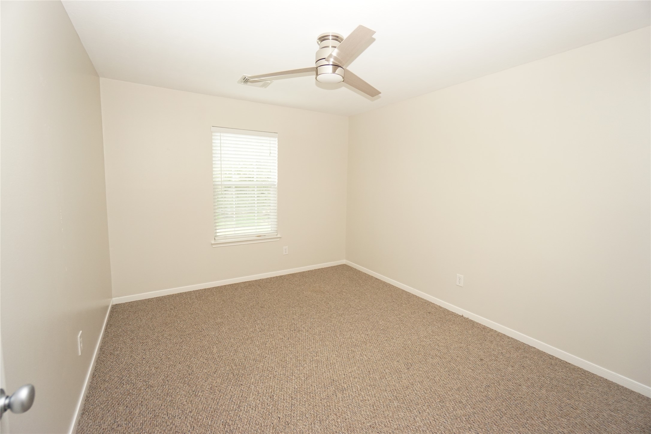 2434 Ranch Hollow Court Katy, TX 77494 - Photo 15 of 20 an empty room with a window
