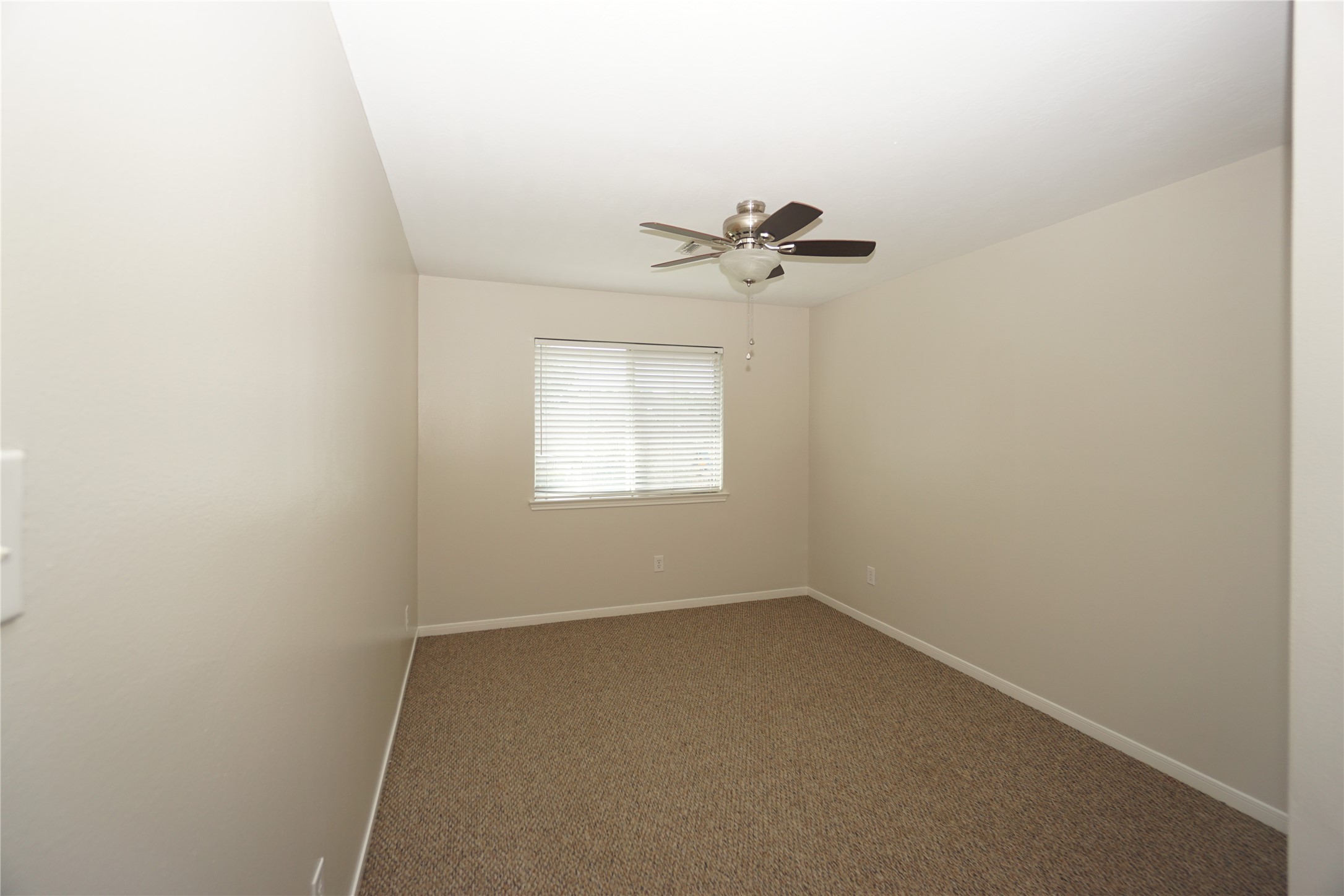 2434 Ranch Hollow Court Katy, TX 77494 - Photo 16 of 20 an empty room with a window