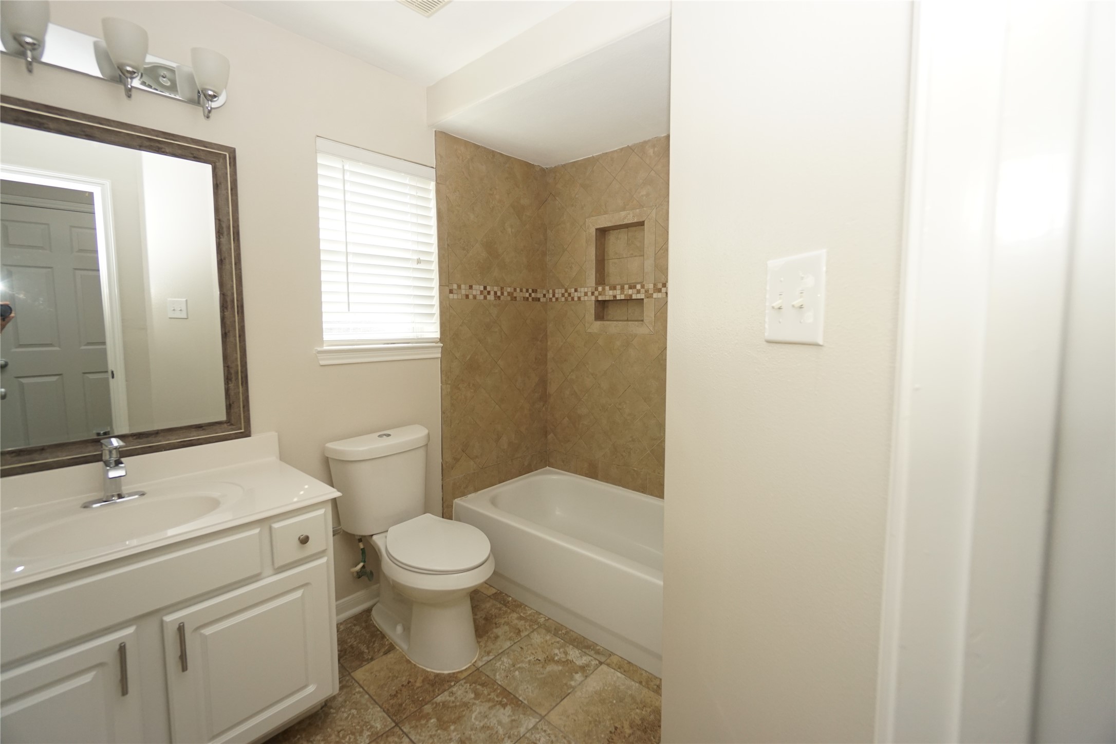 2434 Ranch Hollow Court Katy, TX 77494 - Photo 18 of 20 a bathroom with a sink a toilet and shower