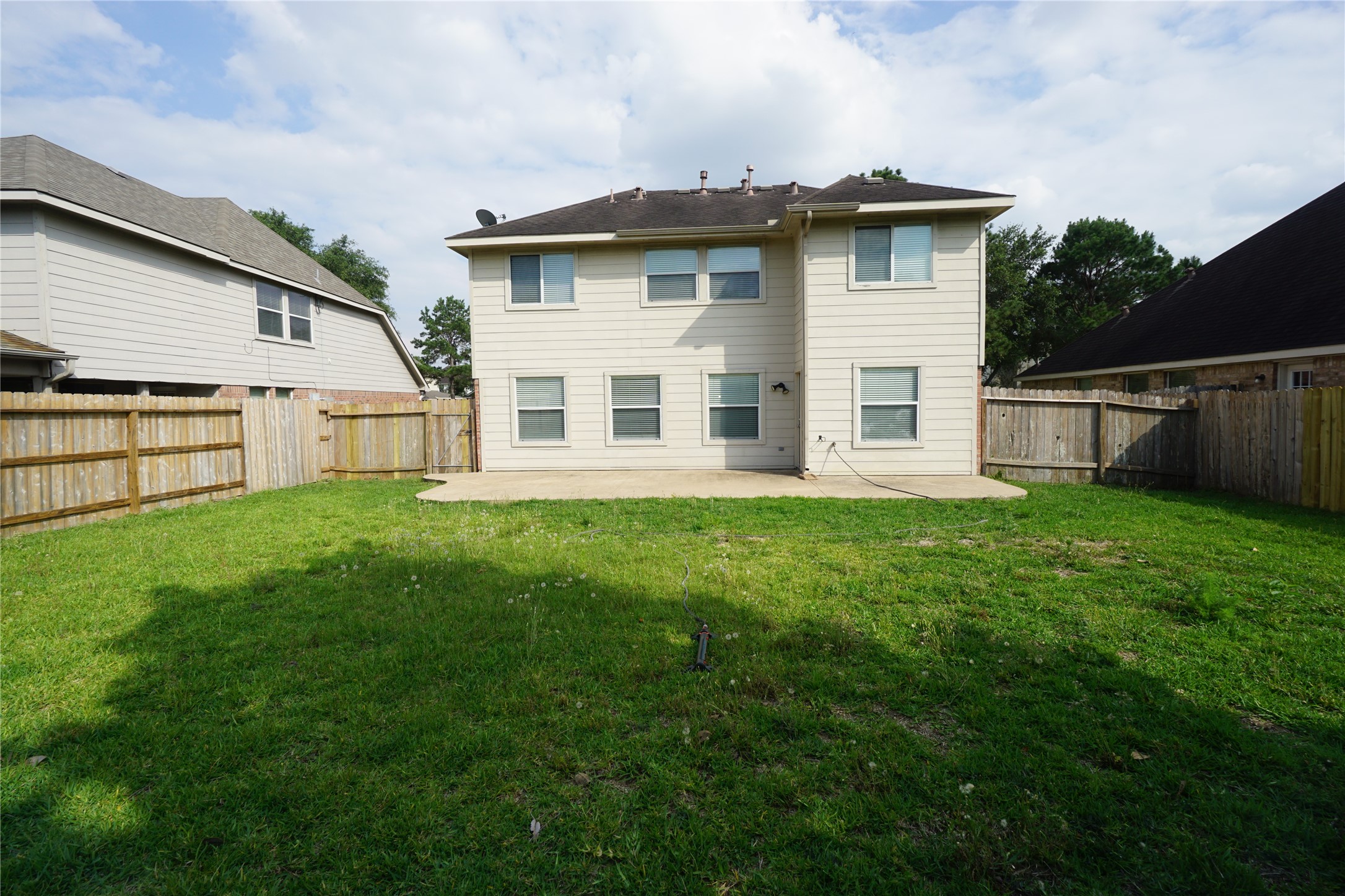 2434 Ranch Hollow Court Katy, TX 77494 - Photo 19 of 20 a white house that has tree in front of it
