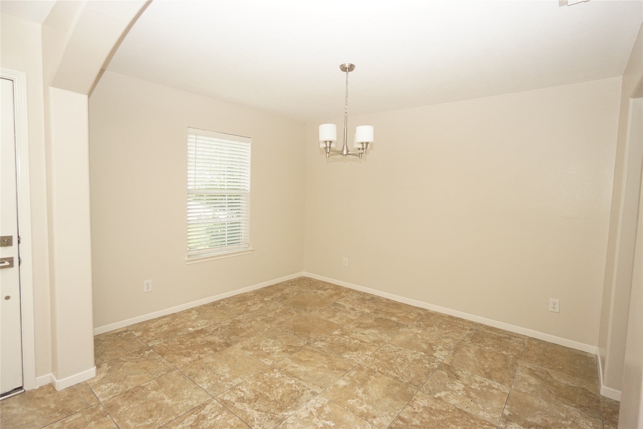 2434 Ranch Hollow Court Katy, TX 77494 - Photo 3 of 20 a view of an empty room with a window