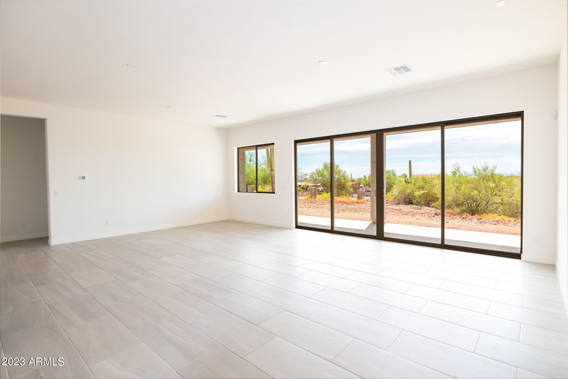 522 North Sun Road Apache Junction, AZ 85119 - Photo 31 of 46 a view of an empty room with a window
