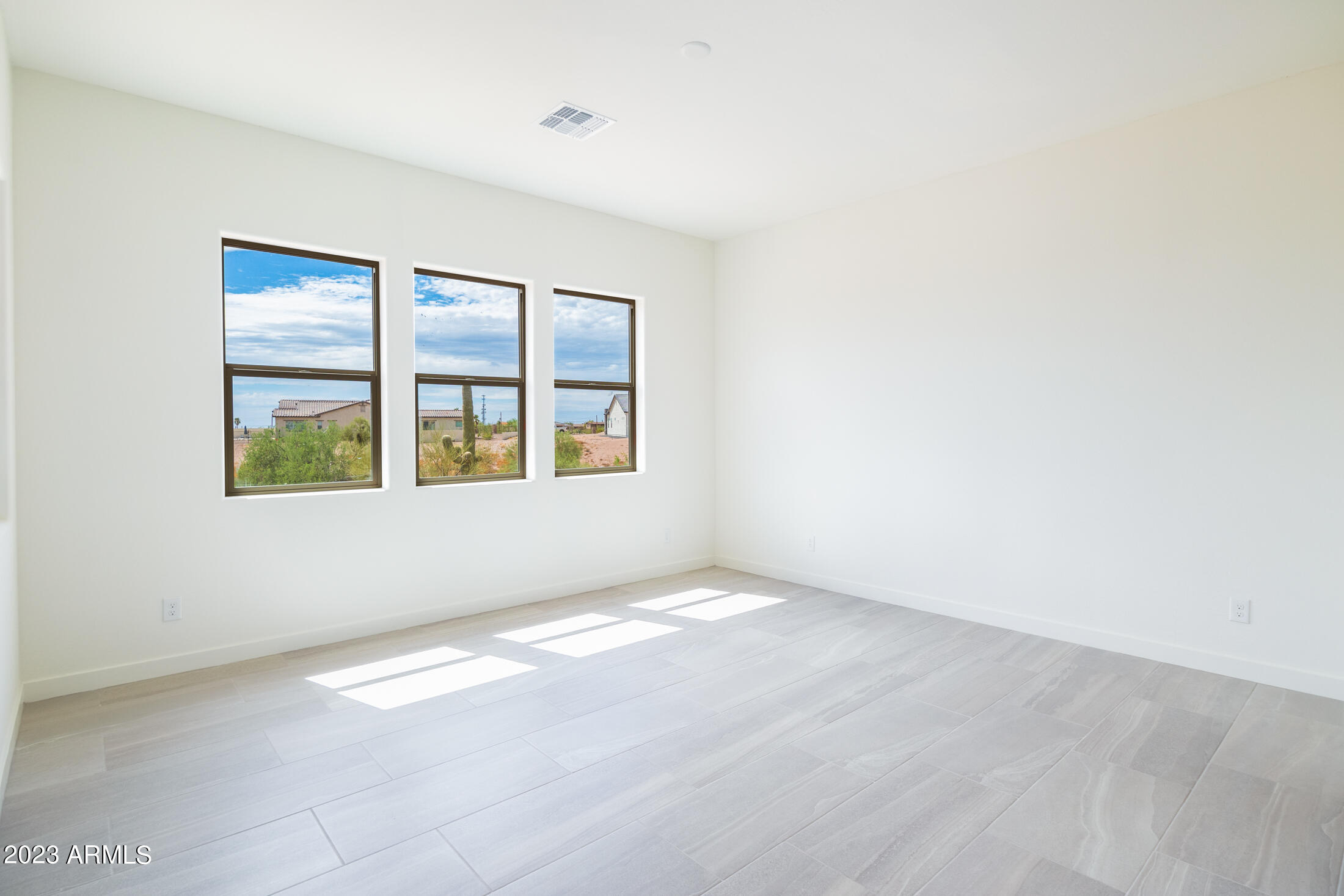 522 North Sun Road Apache Junction, AZ 85119 - Photo 34 of 46 a view of an empty room with a window
