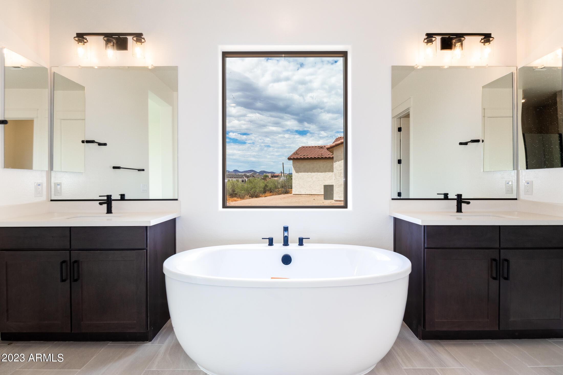 522 North Sun Road Apache Junction, AZ 85119 - Photo 37 of 46 a bathroom with a sink and a mirror
