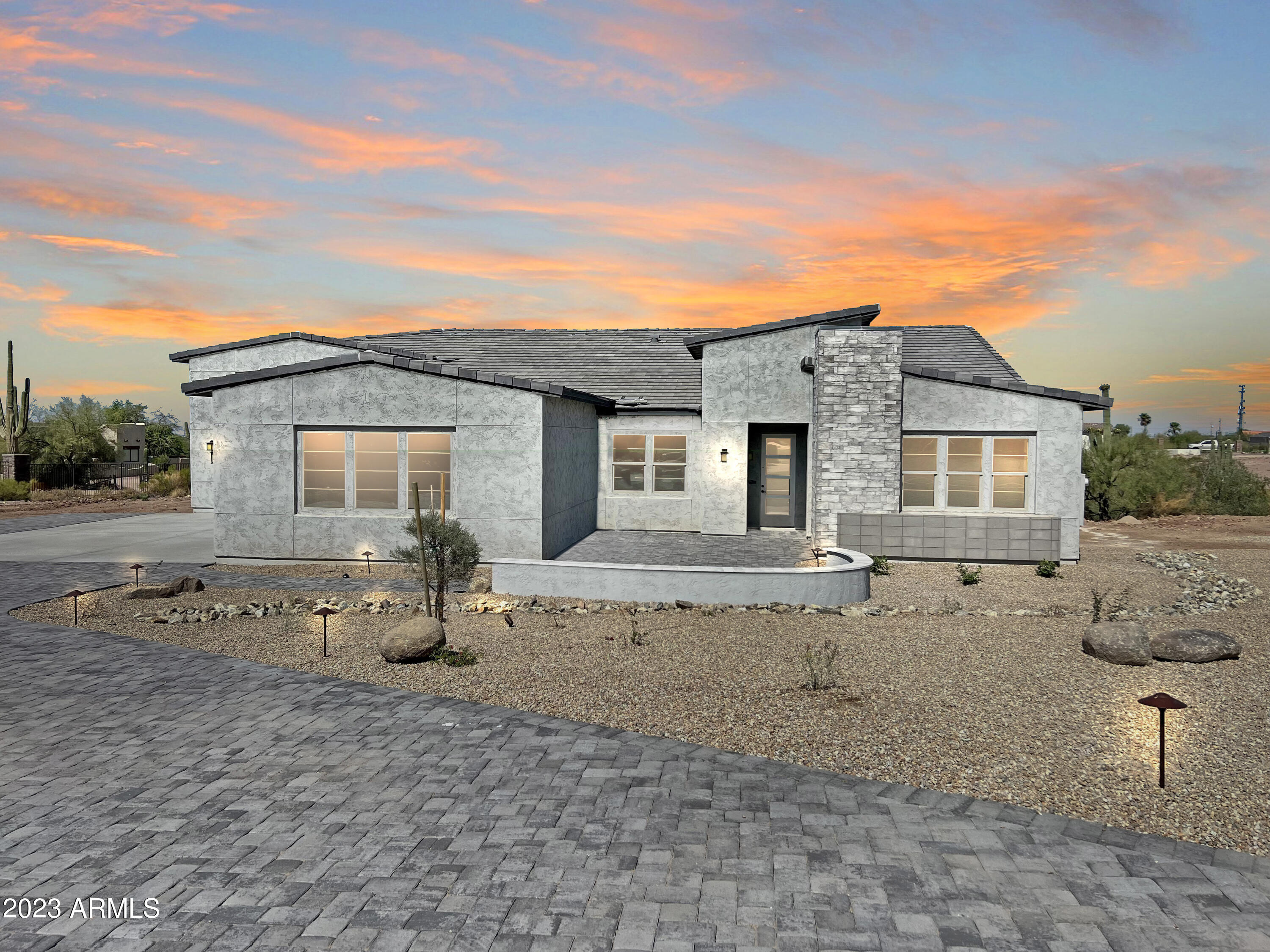 522 North Sun Road Apache Junction, AZ 85119 - Photo 5 of 46 front view of a house with a patio