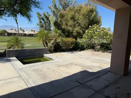 a view of swimming pool with a yard