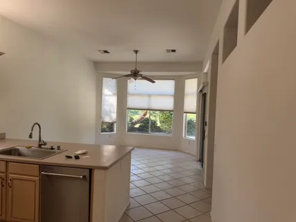 a kitchen with a sink and a window