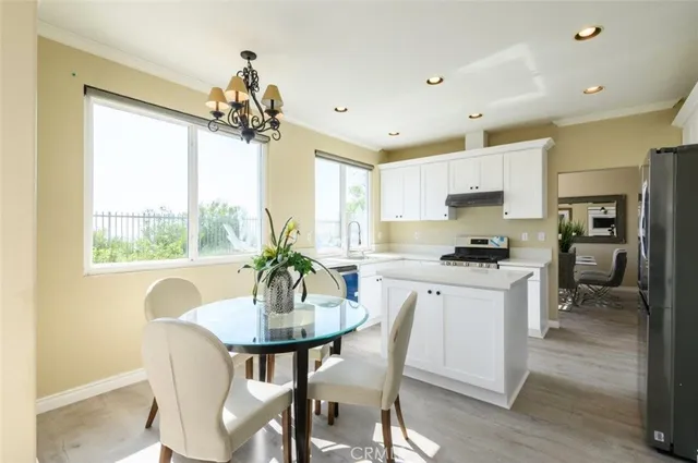 a view of a dining room with furniture window and outside view