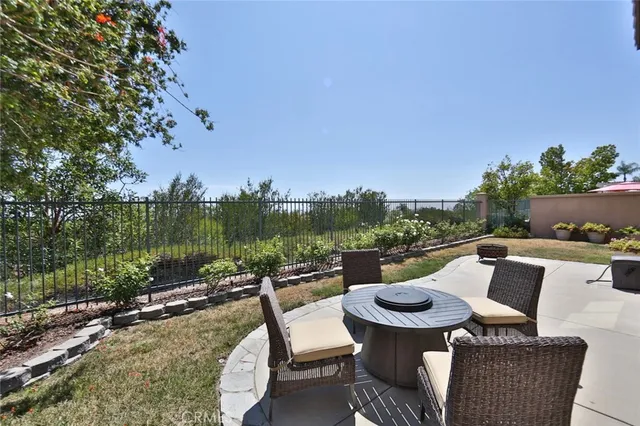 a view of a chairs and table in patio