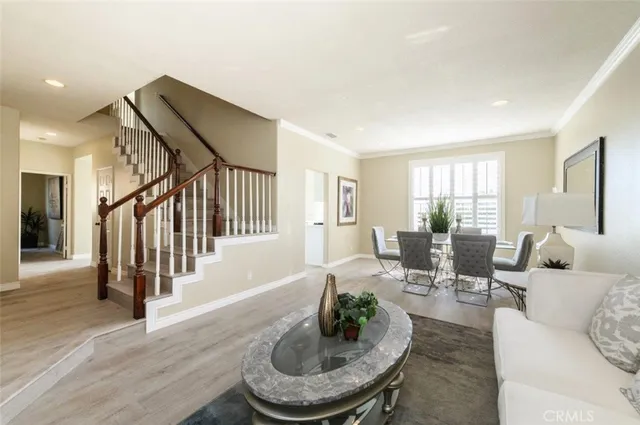 a living room with furniture and a dining room